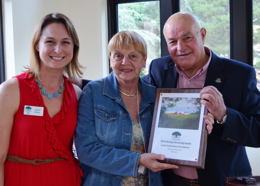Laura Baird, Senior Land Conservationist for Heritage Conservancy, with Bonita and Monty Wernett, recipients of the Land Conservation Award